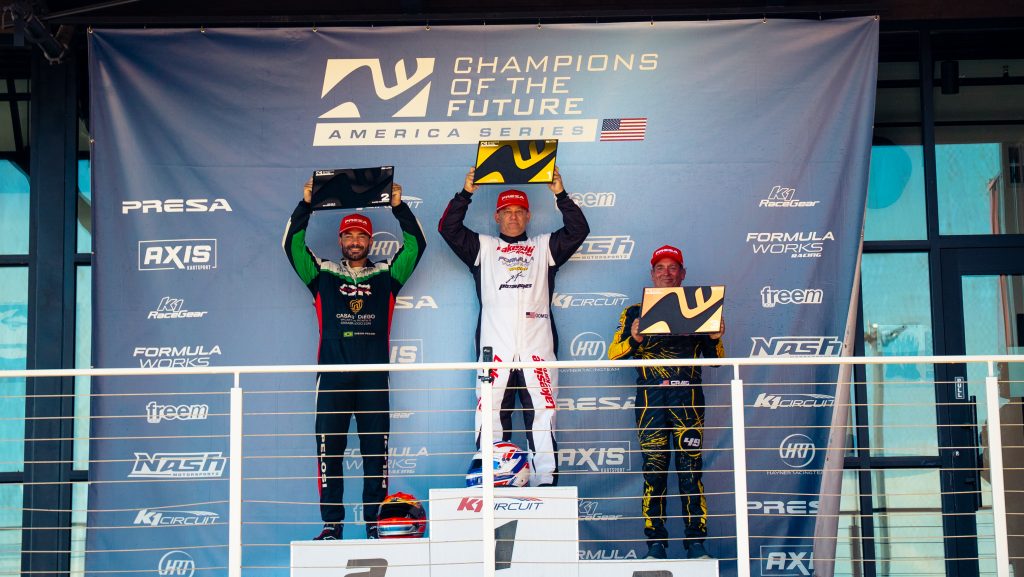 Tony Gomez, Diego Pelosi, and Craig Vasquez stand on the podium with their KA100 Heritage awards during Champions of the Future America's Round 3 event.