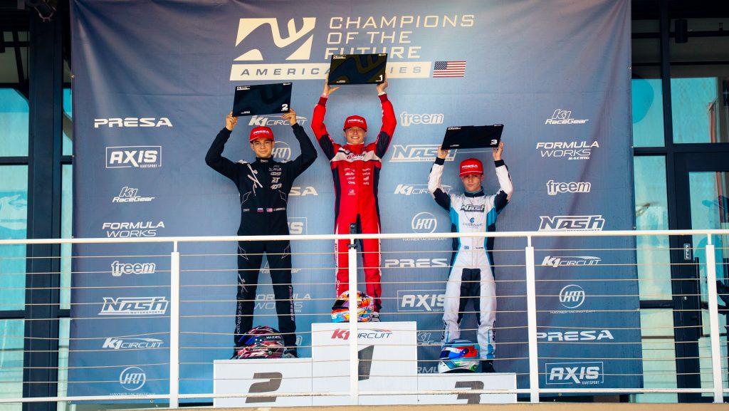 Erik Doan, Sergei Karamseili, and Wrighly Keyes stand on the podium with their X30 Pro awards during Champions of the Future America's Round 3 event.
