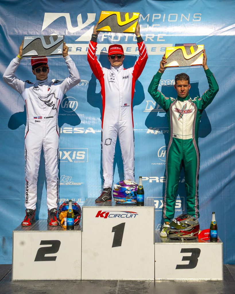 The top three X30 Pro drivers from COTF America's Round 5 event in Pahrump, NV stand on the podium with their trophies