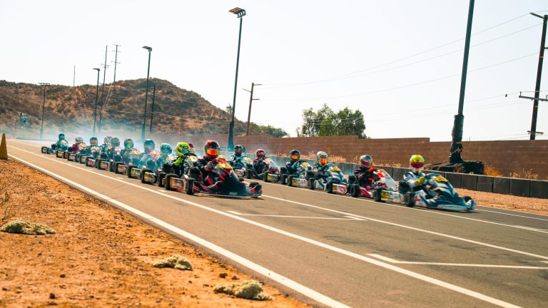 Rows of go-karts and their drivers line up on the grid at K1 Circuit for the start of the KA100 Junior race, part of COTF America's Round 7 event.
