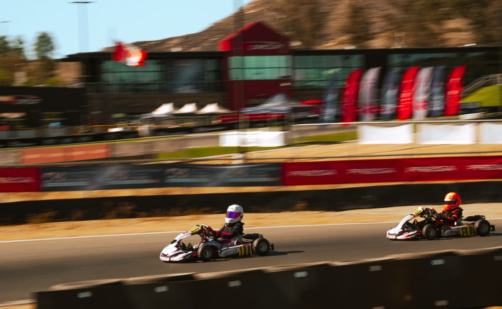 Mini U10 racers race down the esses at K1 Circuit Winchester during the final round of 2026 competition
